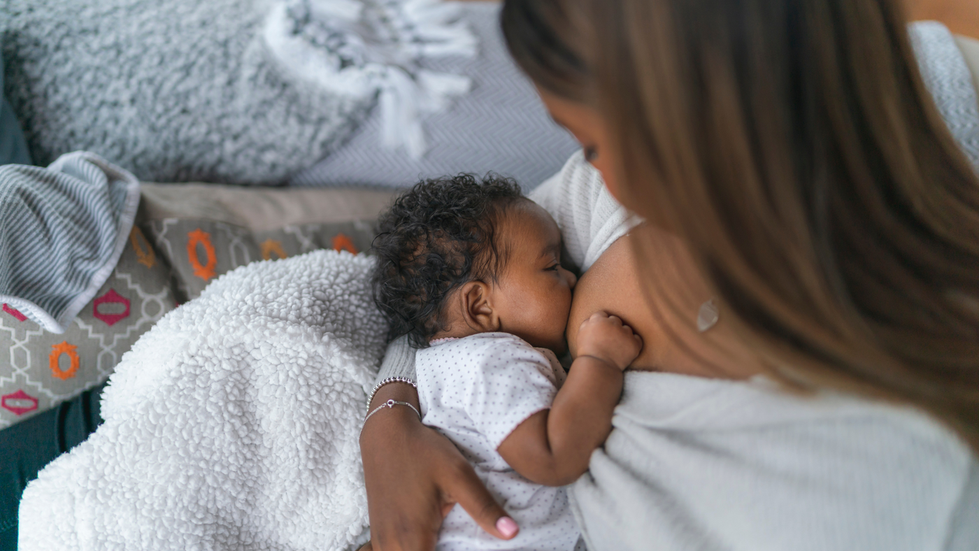 mom breastfeeding baby